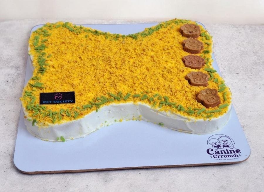Bone-shaped dog cake by Canine Crrunch